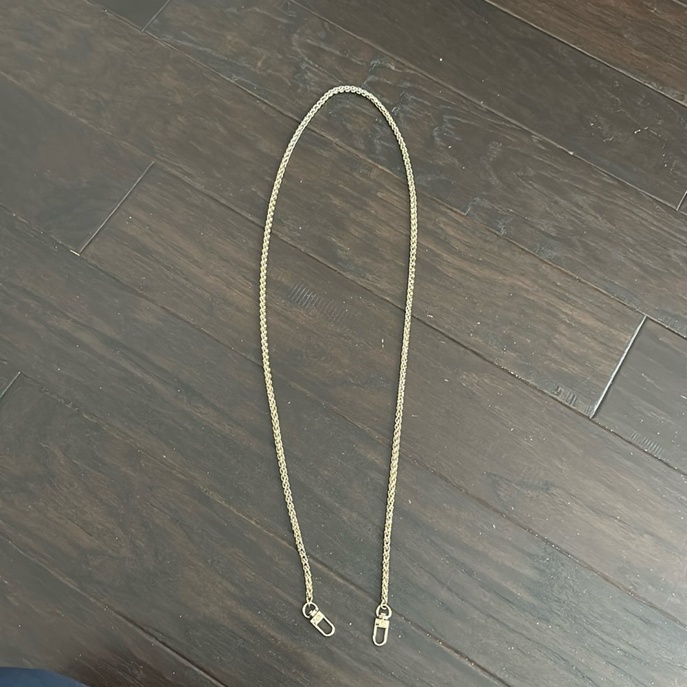 The Caep Goldi Round chain phone leash crossbody